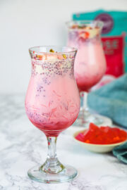 2 glasses of falooda with jelly on the side.