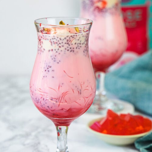 2 glasses of falooda with jelly on the side.
