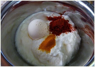 Yogurt, besan and spices in a bowl