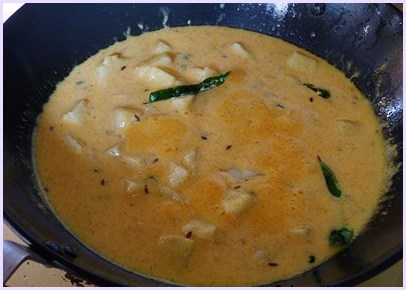 simmering the dahi aloo gravy