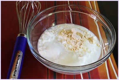 Yogurt and besan in a bowl.