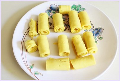 rolled khandvi in a plate.