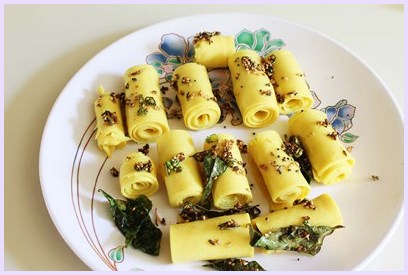 Pouring tadka on khandvi.