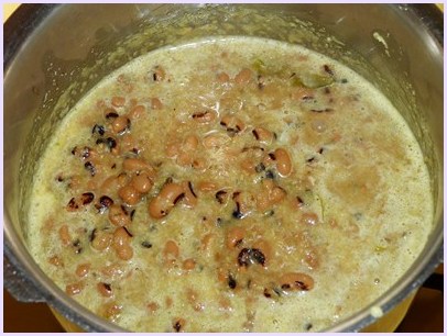 adding paste to cooked beans