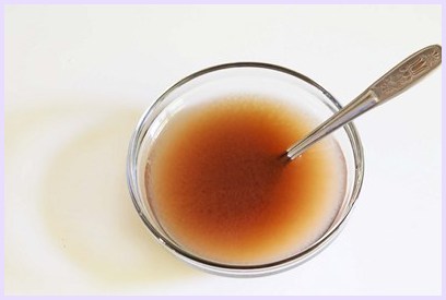 Tamarind water in a bowl.