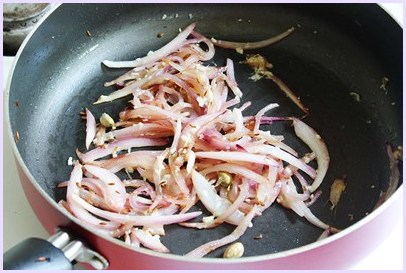 cooking ginger garlic paste in the onions 