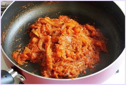 tomatoes are cooked till thick paste