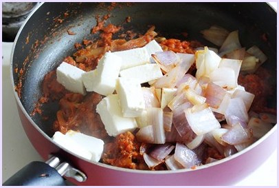 adding paneer and cooked onion cubes