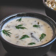 suva kadhi in a bowl served with rice on the side.
