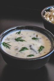 suva kadhi in a bowl served with rice on the side.