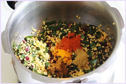 Adding spice powders.