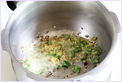 Sauteing ginger, garlic, chili.