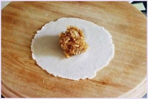 stuffing in the center of the rolled dough