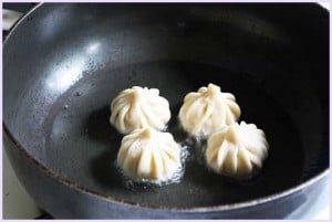 modak frying into hot oil