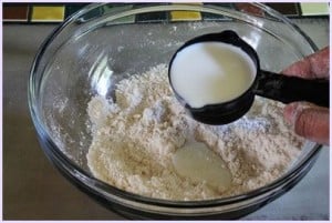 adding milk to knead the dough