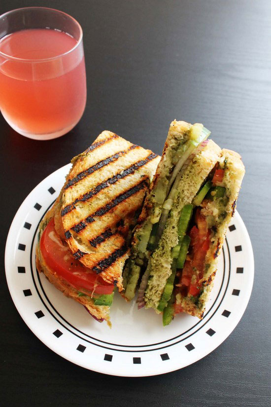 Vegetable grilled sandwich with juice.