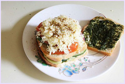 Adding grated cheese.