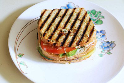 Vegetable grilled sandwich on a plate.