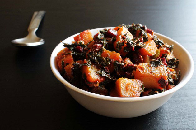 Aloo beet greens sabzi served in a bowl.