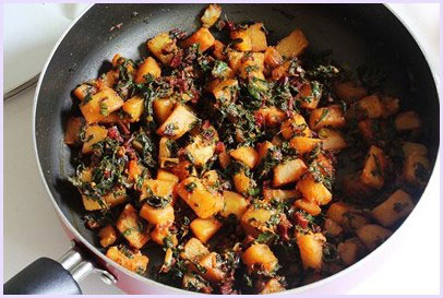 Aloo beet greens sabzi in a pan.