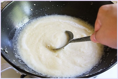 adding water to roasted semolina