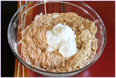 adding yogurt to chakli flour mixture