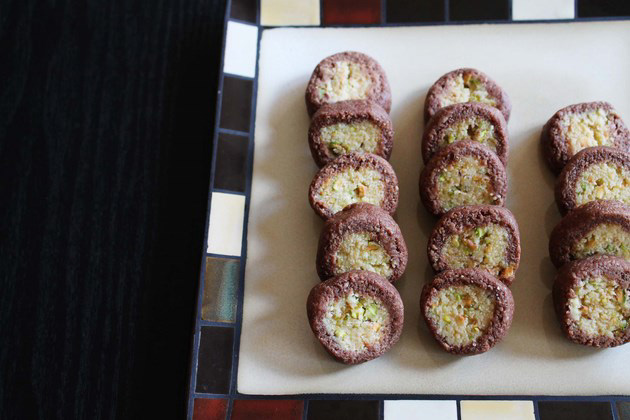 Chocolate pista rolls arranged on a plate