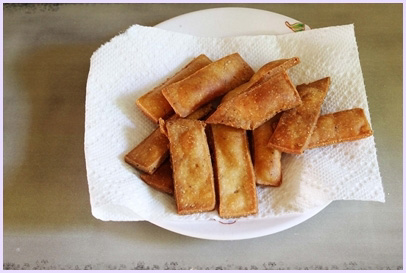 fried nimki on a paper towel lined plate
