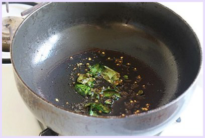 frying chilies and curry leaves till crispy