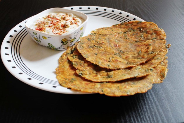 Methi thepla with spice yogurt.