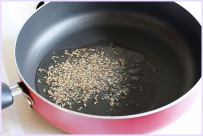Tempering of mustard and cumin seeds.