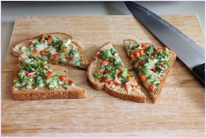 Cutting a triangle chilli cheese toast