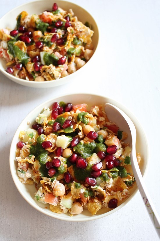 2 plates of oats chaat with spoon.