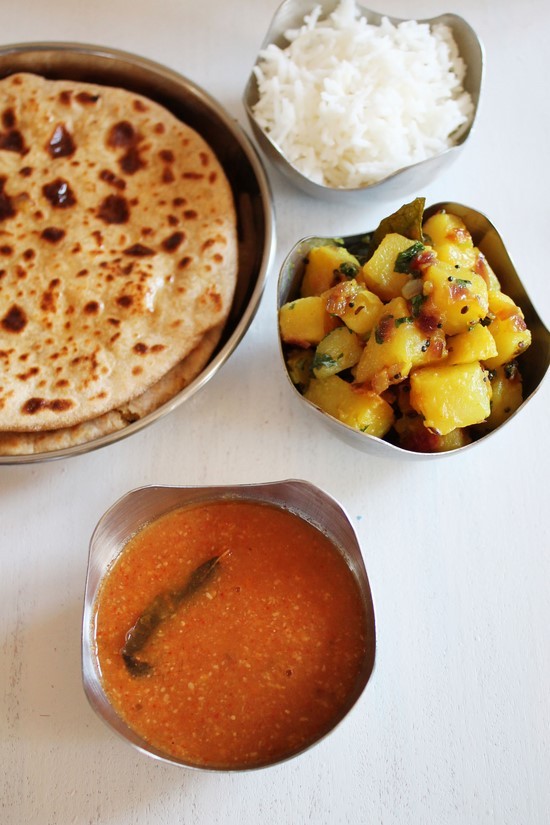 Katachi Amti served with puran poli, batata bhaji and rice.