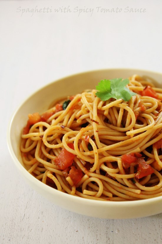 Spaghetti with Spicy Tomato Sauce garnished with cilantro.