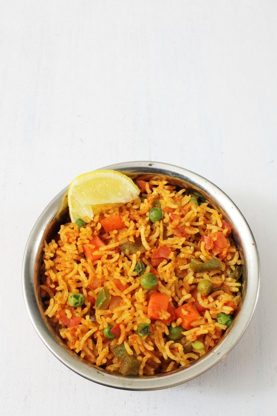 Tawa pulao recipe or Tawa Pulav- Cooked rice is sauteed with vegetables and spiced with pav bhaji masala. This is popular mumbai street food. learn how to make indian tawa pulao by getting the recipe from the site. #streetfood #pulao