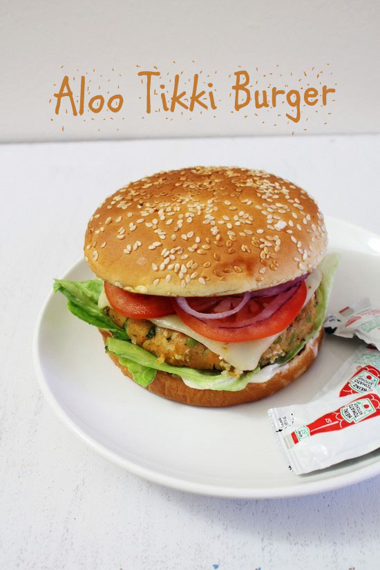 Aloo Tikki Burger in a plate with a packet of ketchup.