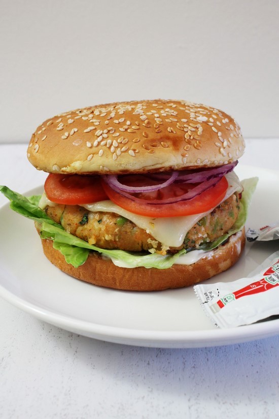 Aloo Tikki Burger served in a plate.