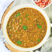 Matki dal served in a bowl, garnished with cilantro.