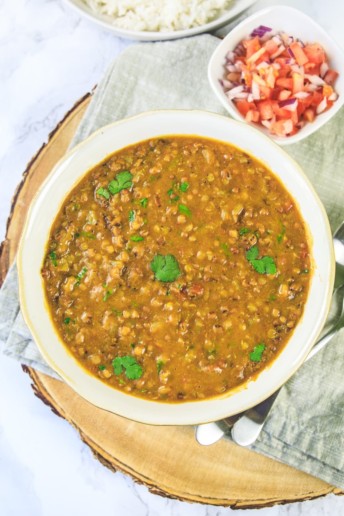 Matki dal served in a bowl, garnished with cilantro.
