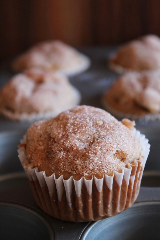 Eggless Apple muffins on a muffin tray.