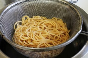 Drained pasta in a colander.