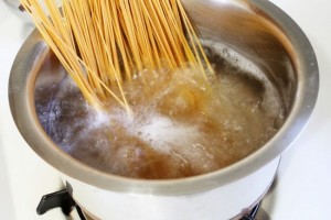 Cooking spaghetti in a boiling water.