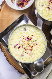 A bowl of sabudana kheer with spoon on the side.