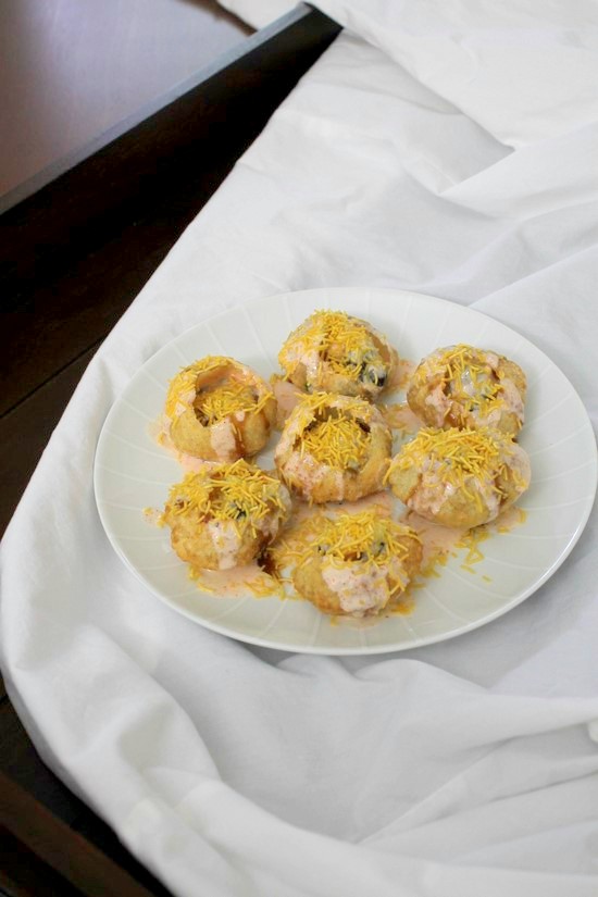 Dahi Puri plate under white cloth.