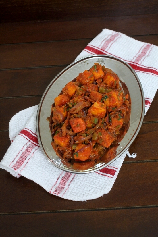 Tawa Paneer in a steel serving plate with napkin under it.