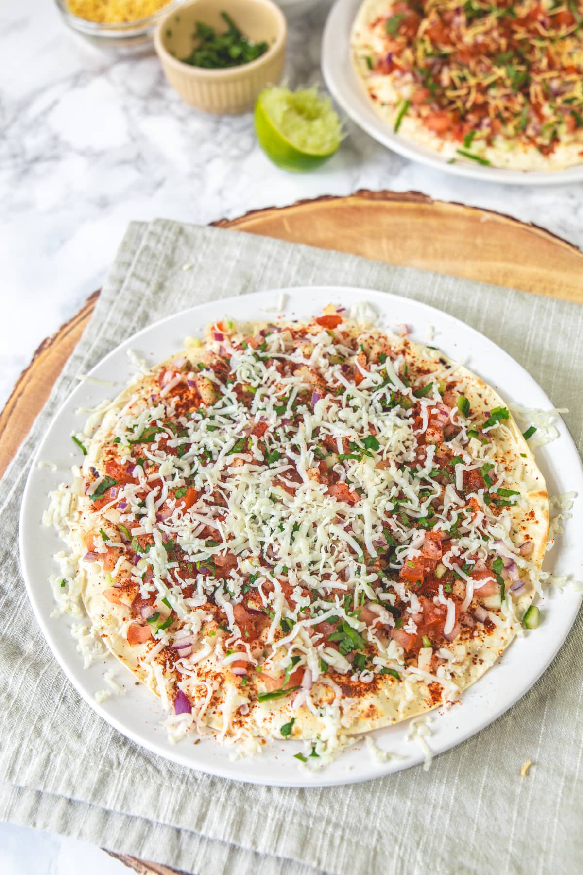 Cheese masala papad in a plate.