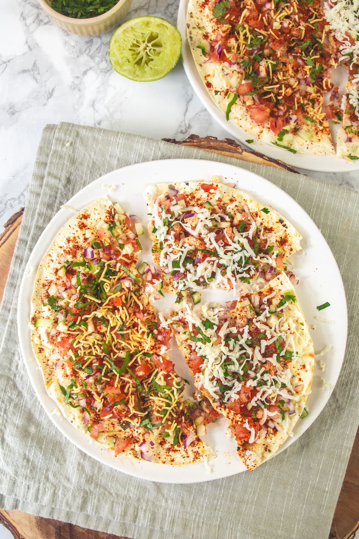 Regular masala papad and cheese version in a plate.