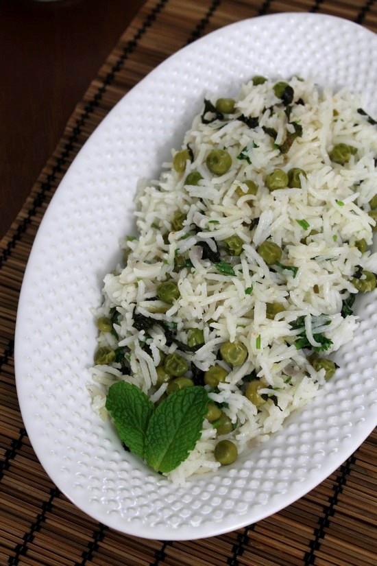 Green peas pulao recipe with step by step photos - this is a simple Indian rice dish made with basmati rice and green peas. Addition of cilantro and mint leaves adds fresh flavors. Pack this one pot meal into the lunch box. and don't forget to pack a small container of yogurt or raita for the side. #rice #indianfood #pulao