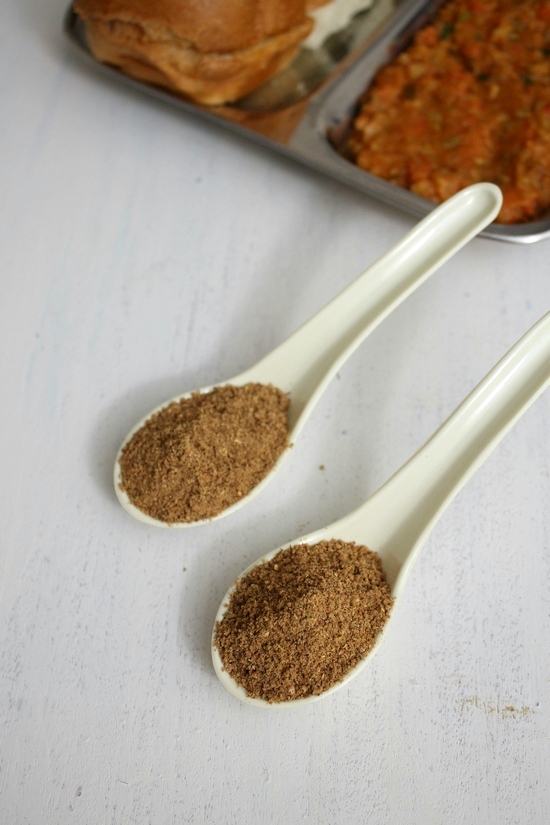 Pav bhaji masala powder in two spoons.